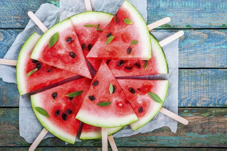 Watermelon slices are placed on a stick as a snack for the watermelon diet